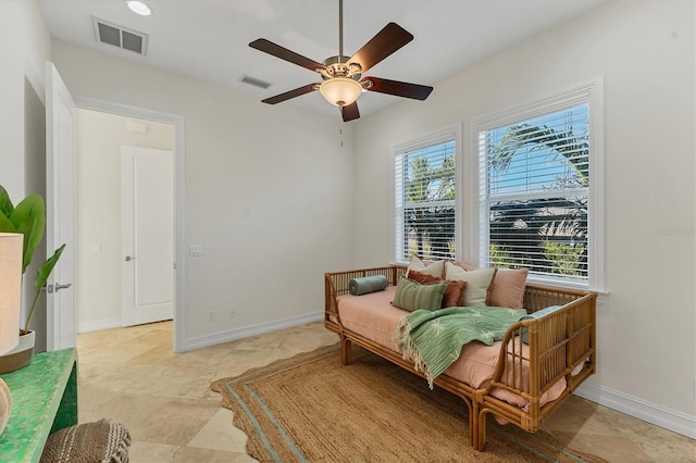 sitting room featuring ceiling fan