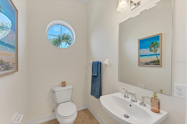 bathroom with toilet and sink