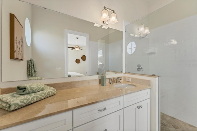 bathroom featuring vanity and a tile shower