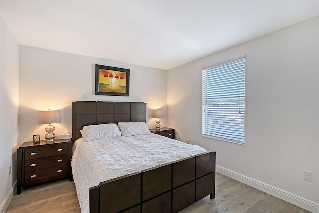 bedroom with light hardwood / wood-style floors