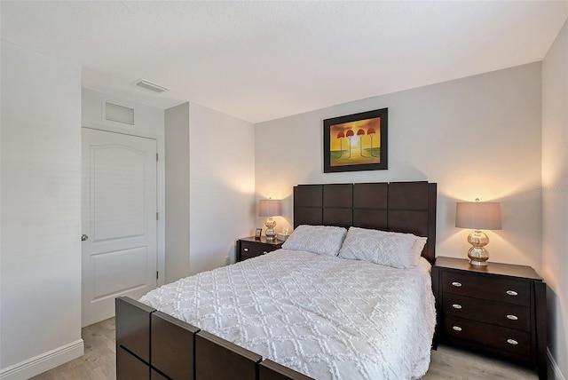 bedroom with light hardwood / wood-style floors