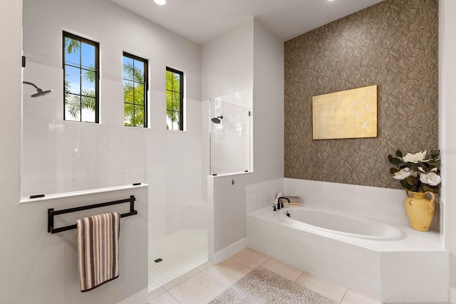 bathroom featuring shower with separate bathtub and tile patterned flooring