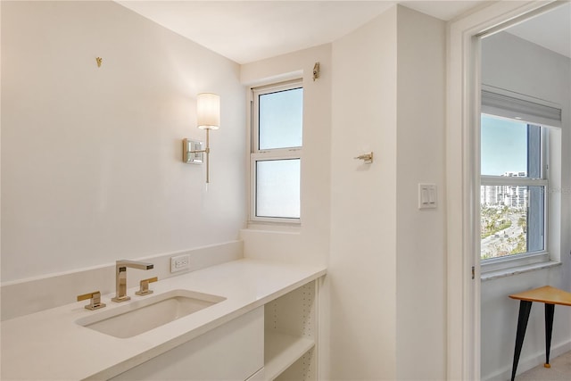 bathroom with a healthy amount of sunlight and sink