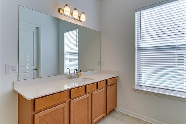 bathroom featuring tile patterned flooring and vanity