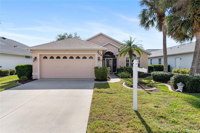 view of front of property featuring a garage and a front lawn