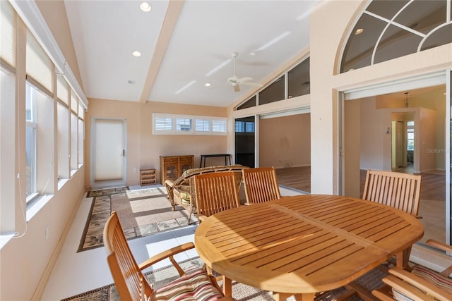 dining room featuring ceiling fan, plenty of natural light, and high vaulted ceiling