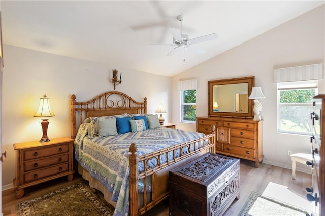 bedroom featuring hardwood / wood-style flooring, ceiling fan, and vaulted ceiling