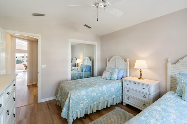 bedroom featuring lofted ceiling, dark wood-type flooring, and ceiling fan