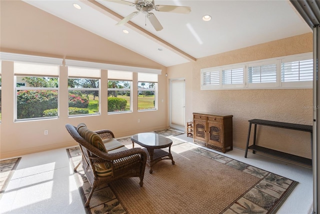 sunroom with ceiling fan and lofted ceiling with beams