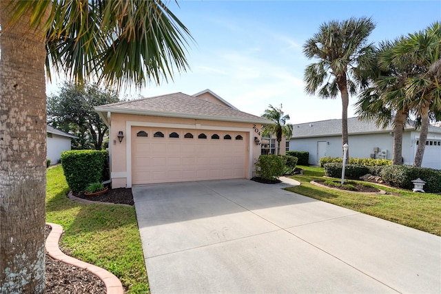 single story home with a garage and a front yard