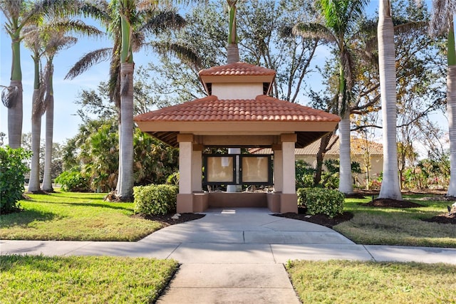 view of property's community featuring a gazebo and a lawn