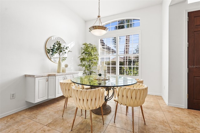 dining space featuring light tile patterned flooring