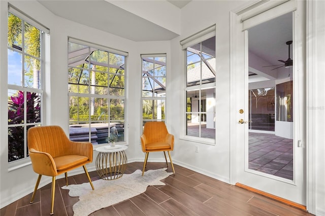 sunroom / solarium with ceiling fan