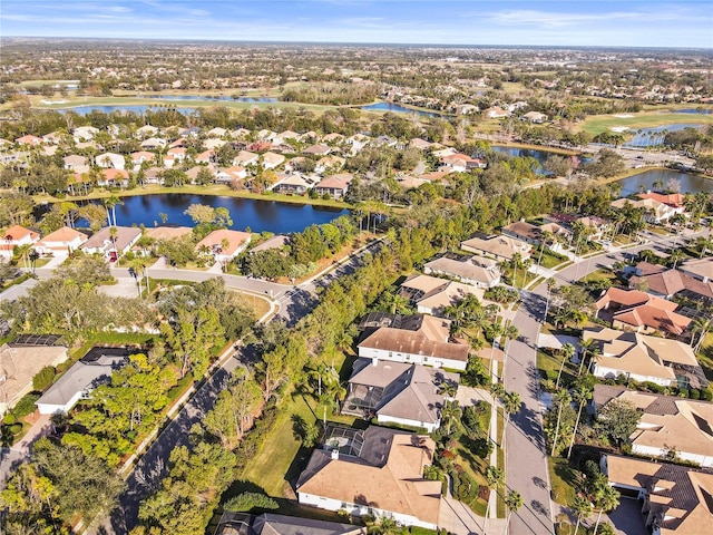 aerial view with a residential view and a water view