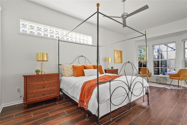 bedroom with wood tiled floor and baseboards