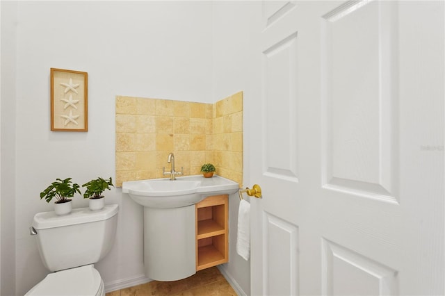 bathroom featuring toilet and tile patterned floors