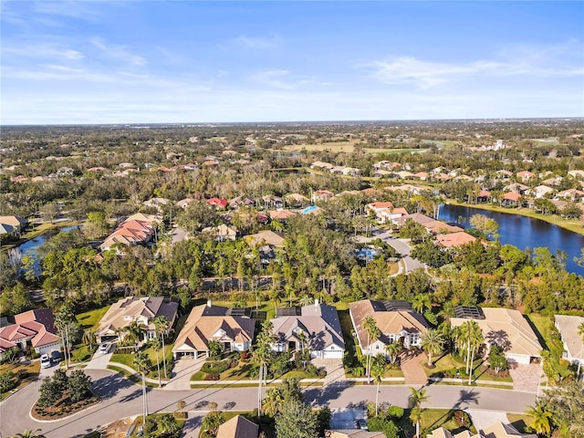 aerial view with a water view and a residential view