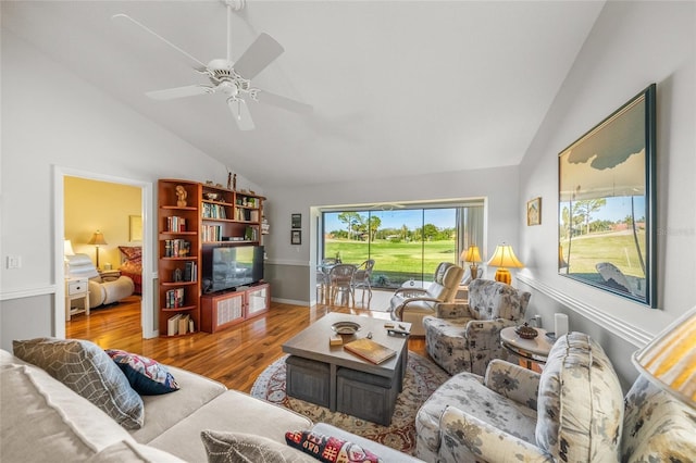 living room featuring hardwood / wood-style flooring, lofted ceiling, and ceiling fan