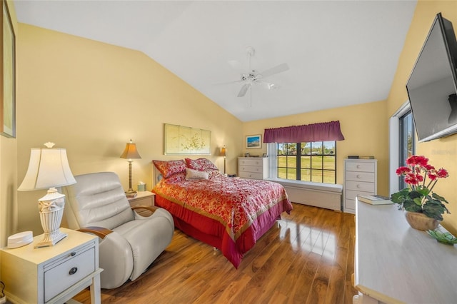 bedroom featuring vaulted ceiling, wood-type flooring, and ceiling fan