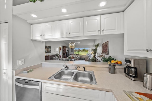 kitchen with white cabinetry, dishwasher, and sink