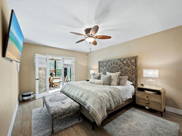 bedroom featuring wood-type flooring, access to outside, ceiling fan, and a textured ceiling