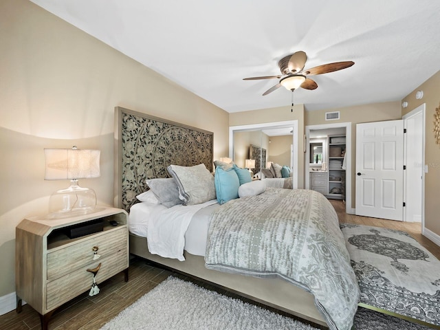 bedroom featuring dark hardwood / wood-style floors and ceiling fan