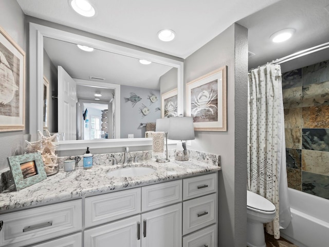 full bathroom with vanity, shower / bathtub combination with curtain, and toilet