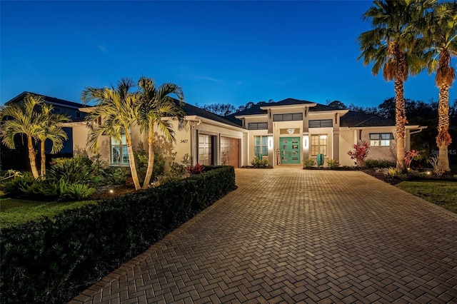 view of front of property with french doors and a garage