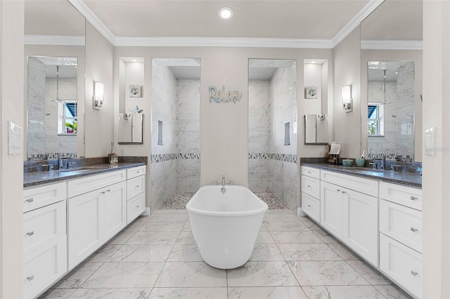 bathroom featuring independent shower and bath, ornamental molding, and vanity