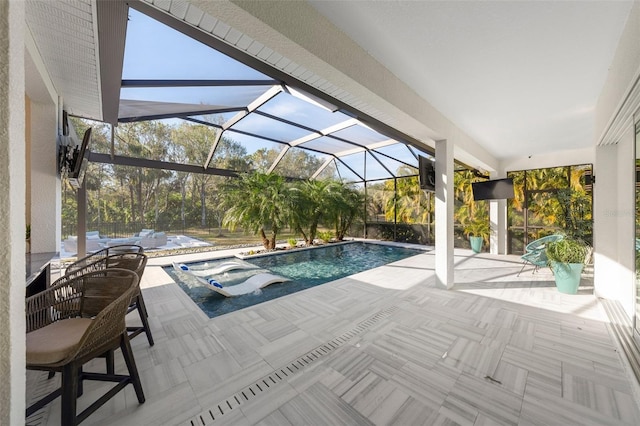 view of swimming pool featuring a patio area, glass enclosure, and a jacuzzi