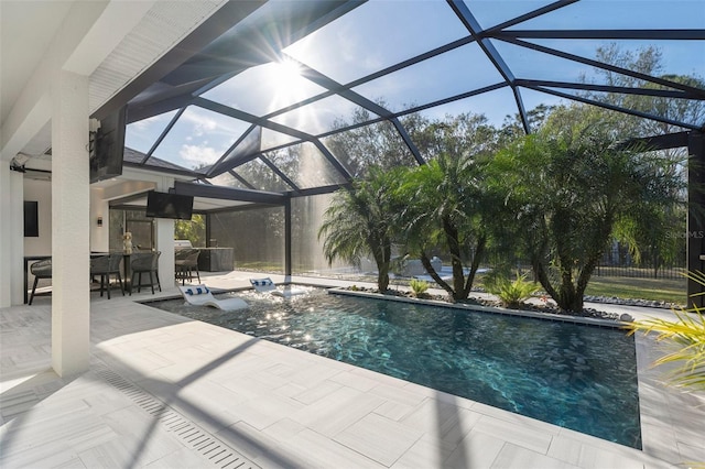 view of pool featuring a patio and glass enclosure