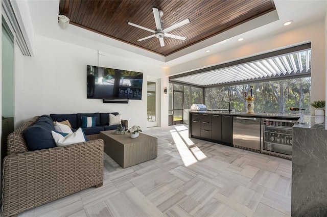 view of patio / terrace with sink, beverage cooler, exterior kitchen, an outdoor hangout area, and ceiling fan