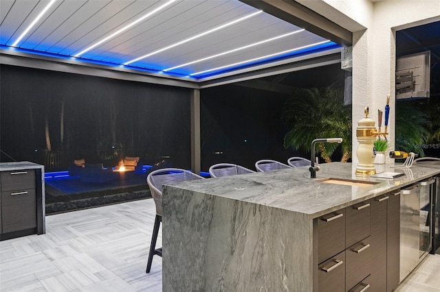 view of patio / terrace featuring an outdoor wet bar