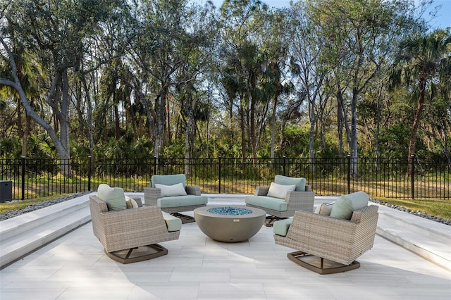 view of patio featuring an outdoor living space with a fire pit