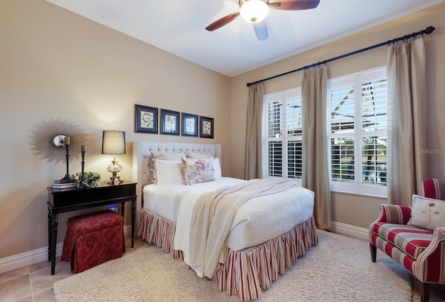 bedroom featuring tile patterned floors and ceiling fan