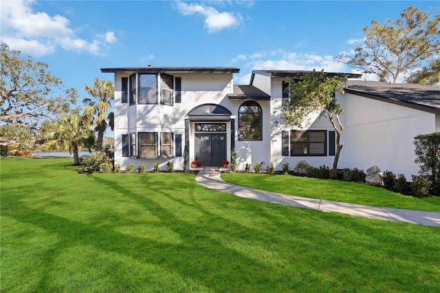 view of front of home with a front lawn