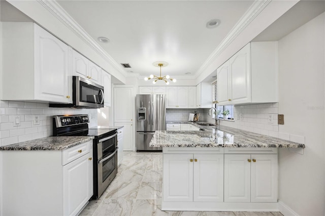 kitchen with stone counters, appliances with stainless steel finishes, sink, white cabinets, and kitchen peninsula