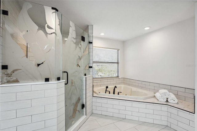 bathroom featuring tile patterned flooring and shower with separate bathtub