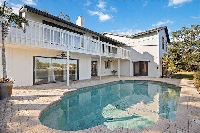 exterior space with a patio area, ceiling fan, and french doors