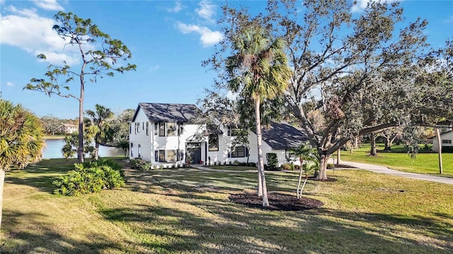 view of front of property with a water view and a front yard