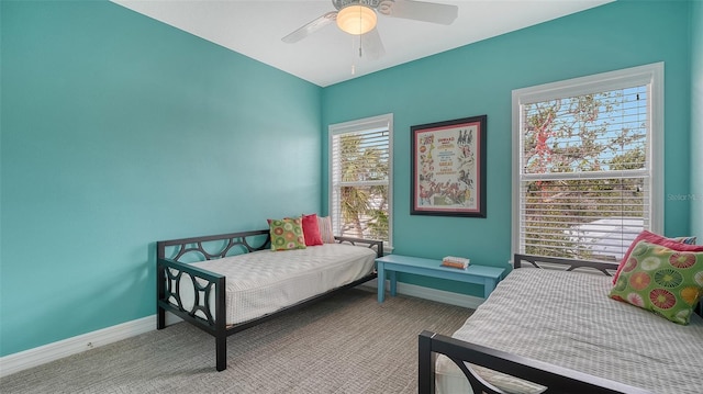 bedroom with ceiling fan and carpet flooring