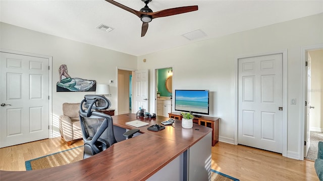 home office with ceiling fan and light wood-type flooring