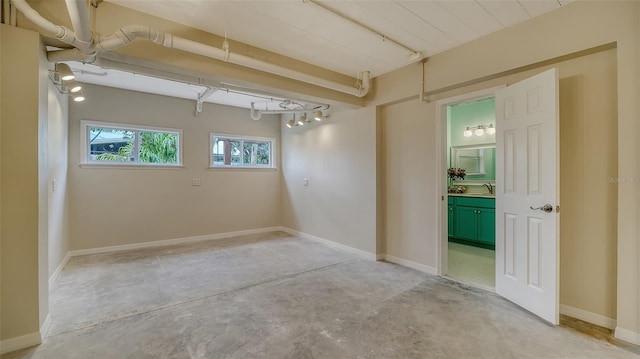 unfurnished room with sink