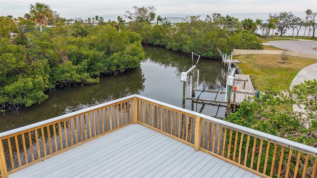 deck featuring a water view and a boat dock