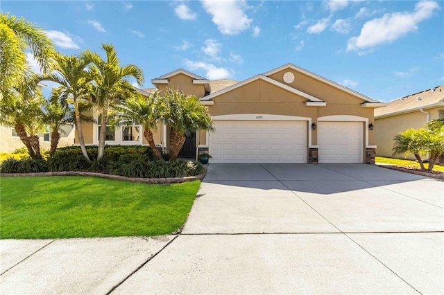 view of front of home featuring a garage and a front yard