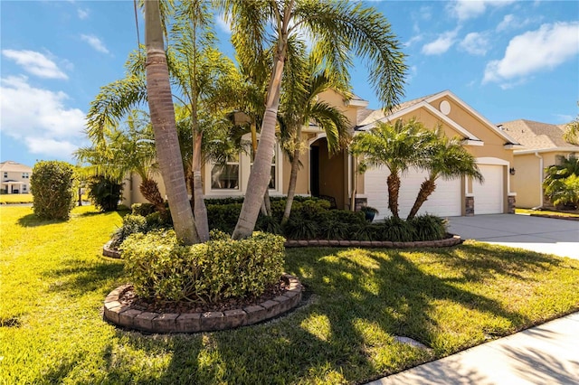 view of front of house with a garage and a front yard