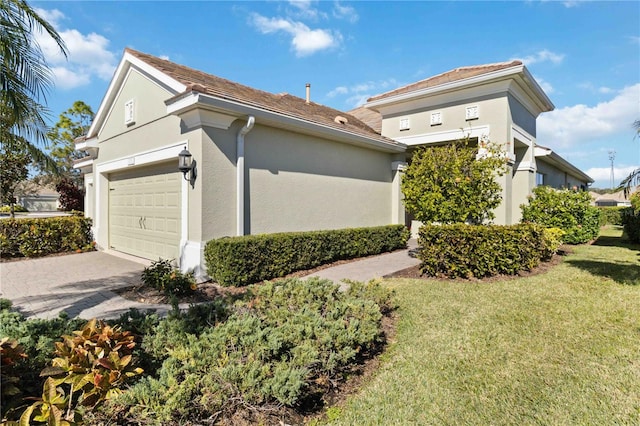 4891 Maymont Park Cir, Bradenton, FL 34203 - view of home's exterior featuring a garage and a yard
