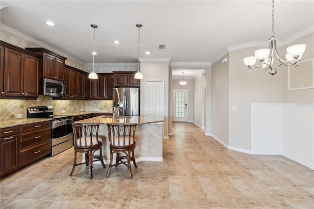 4891 Maymont Park Cir, Bradenton, FL 34203 - kitchen with light stone counters, dark brown cabinetry, appliances with stainless steel finishes, and a kitchen island with sink