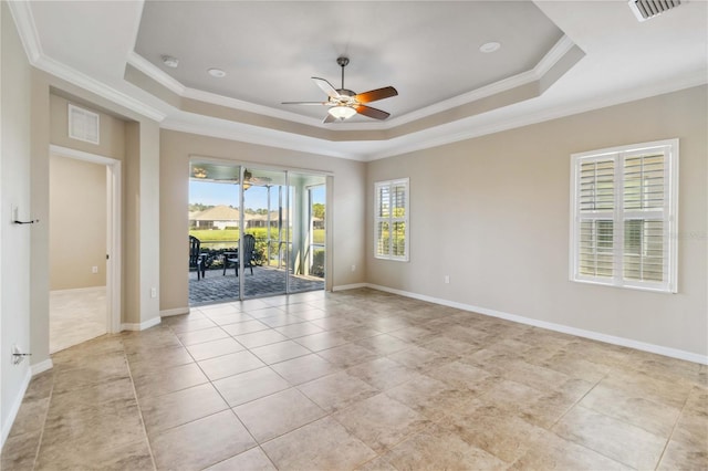 4891 Maymont Park Cir, Bradenton, FL 34203 - tiled empty room with ornamental molding, a raised ceiling, and ceiling fan