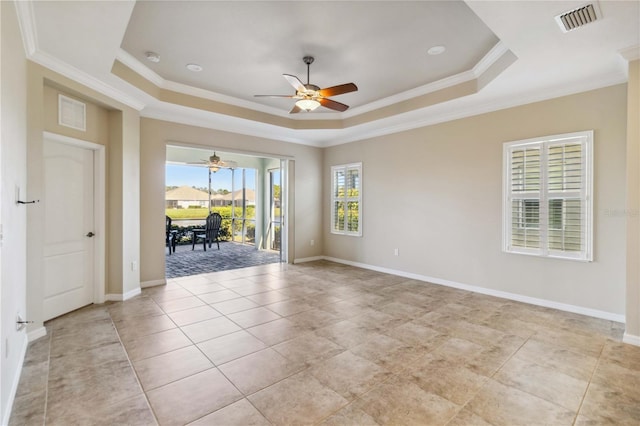 4891 Maymont Park Cir, Bradenton, FL 34203 - unfurnished room featuring ornamental molding, ceiling fan, and a tray ceiling